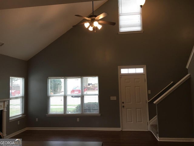 entrance foyer featuring ceiling fan, high vaulted ceiling, and dark hardwood / wood-style floors