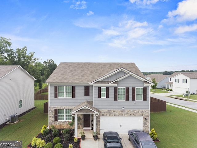 view of front facade featuring cooling unit, a garage, and a front lawn