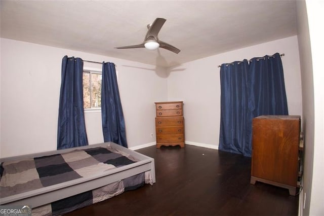 bedroom featuring ceiling fan and dark hardwood / wood-style flooring