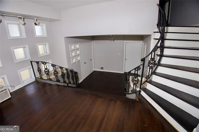 foyer entrance with dark hardwood / wood-style flooring