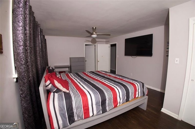 bedroom with ceiling fan and dark wood-type flooring