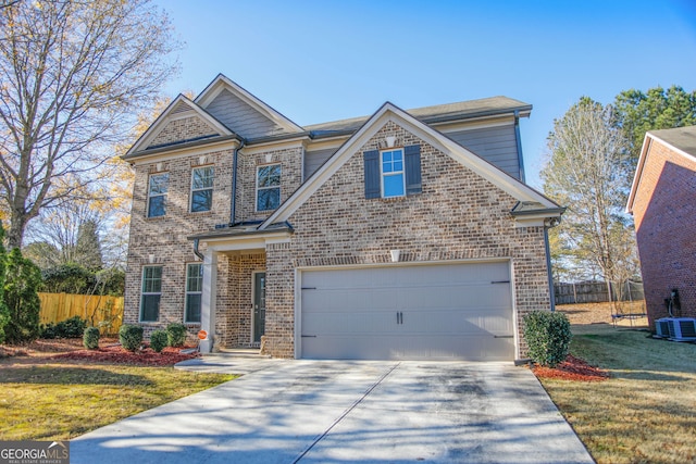 view of front of house with a front yard, brick siding, fence, and driveway