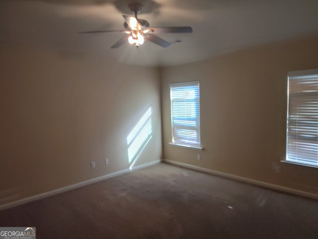 empty room with carpet and ceiling fan