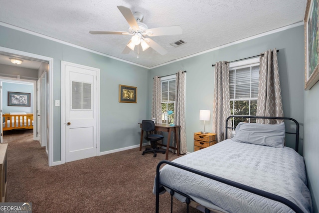 bedroom featuring carpet flooring, ceiling fan, ornamental molding, and a textured ceiling