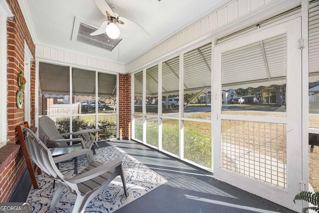 sunroom featuring ceiling fan