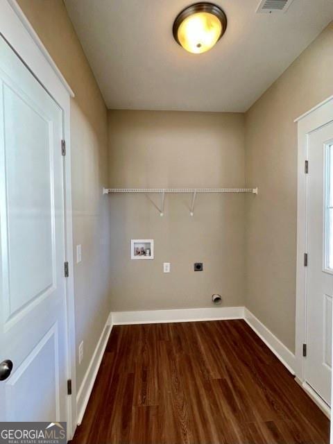 laundry room with electric dryer hookup, dark hardwood / wood-style flooring, and hookup for a washing machine