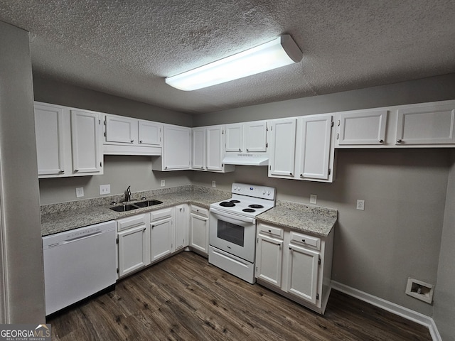 kitchen featuring under cabinet range hood, white appliances, white cabinetry, and a sink