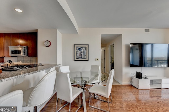 dining area featuring light hardwood / wood-style flooring