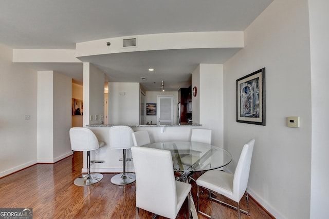 dining space featuring hardwood / wood-style floors