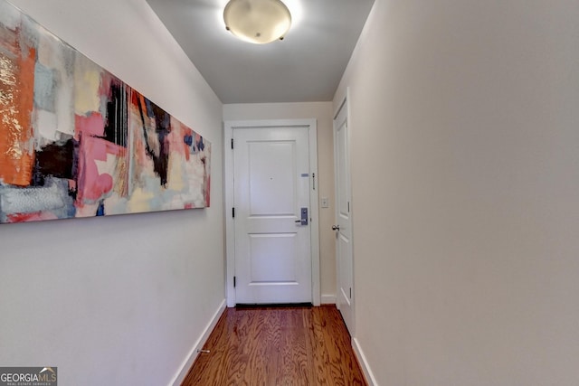 entryway with hardwood / wood-style flooring