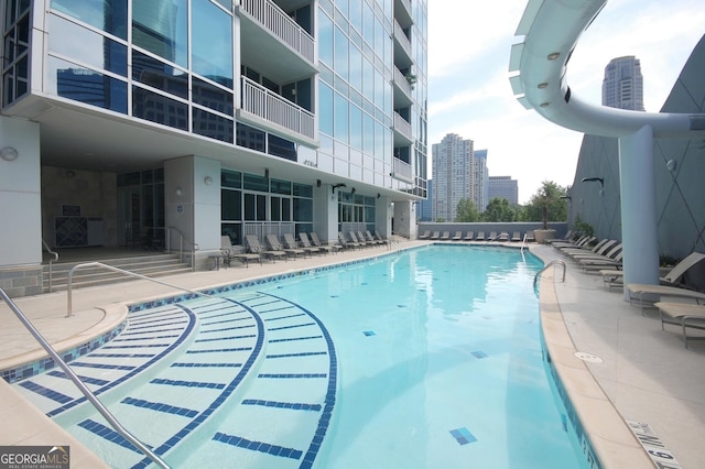 view of swimming pool with a patio