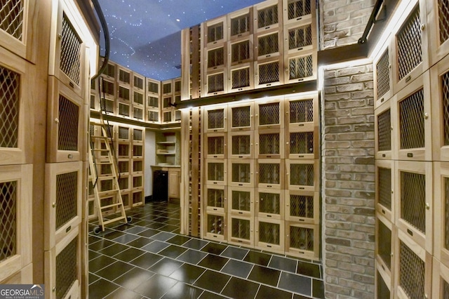 wine room with a high ceiling