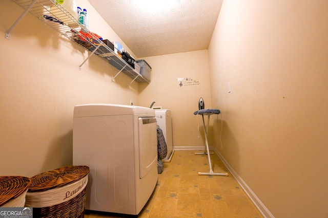 laundry room featuring a textured ceiling