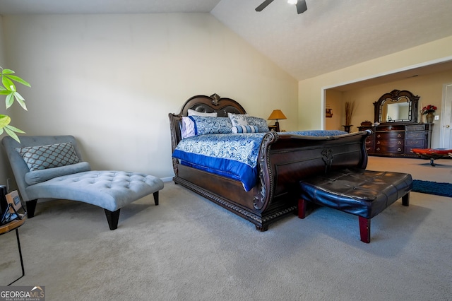 carpeted bedroom with vaulted ceiling and ceiling fan