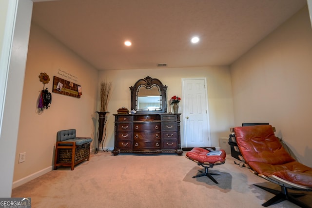 living area featuring light colored carpet