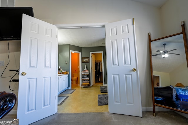 bedroom with a walk in closet and ensuite bath