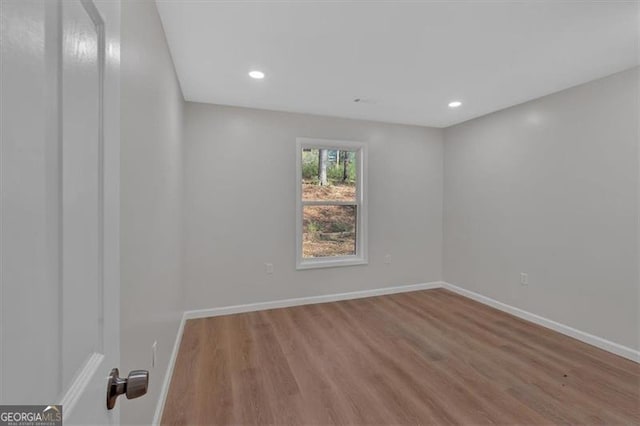 empty room with light hardwood / wood-style floors