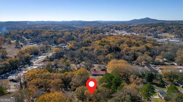 birds eye view of property featuring a mountain view