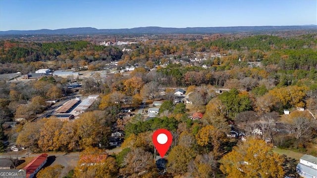 drone / aerial view featuring a mountain view