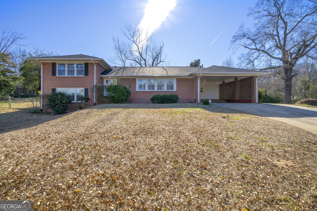 view of front of home with a carport