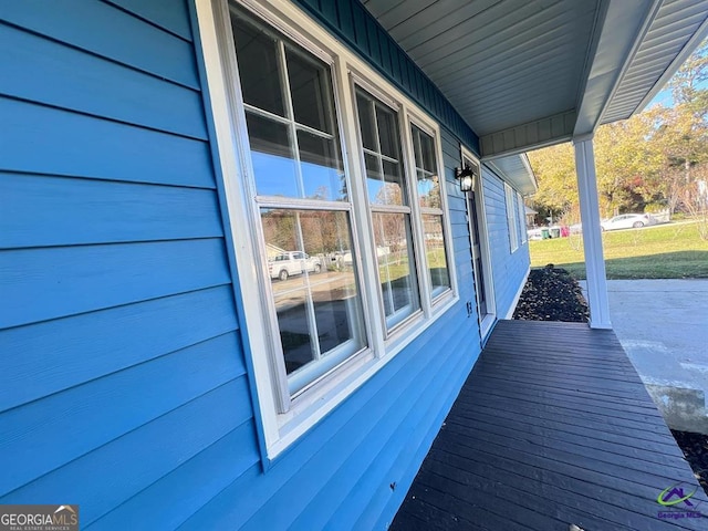 view of property exterior with covered porch