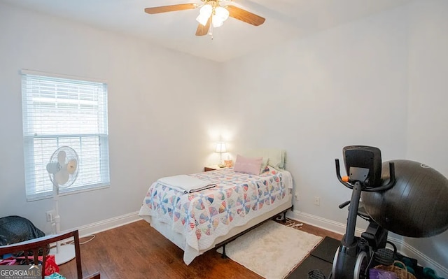 bedroom featuring dark hardwood / wood-style flooring and ceiling fan