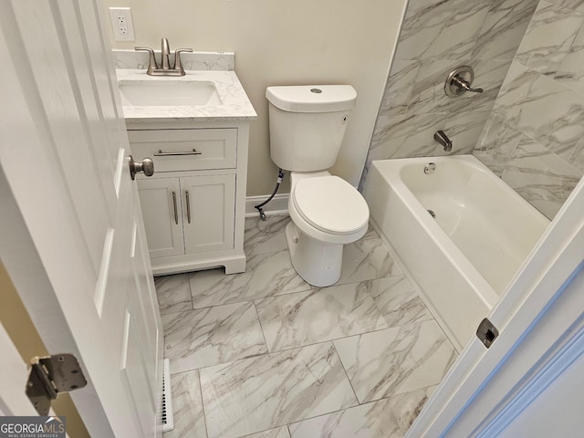 full bathroom with vanity, toilet, and tiled shower / bath