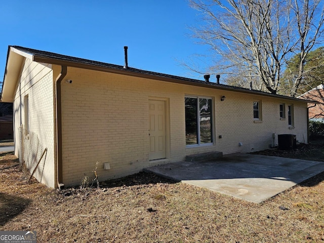 back of house featuring a patio area and central AC