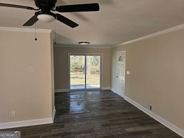 empty room featuring dark hardwood / wood-style flooring, ceiling fan, and crown molding