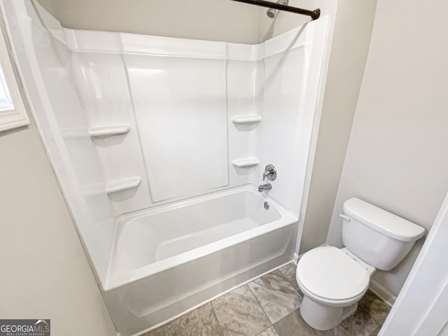 bathroom with shower / bathtub combination and toilet