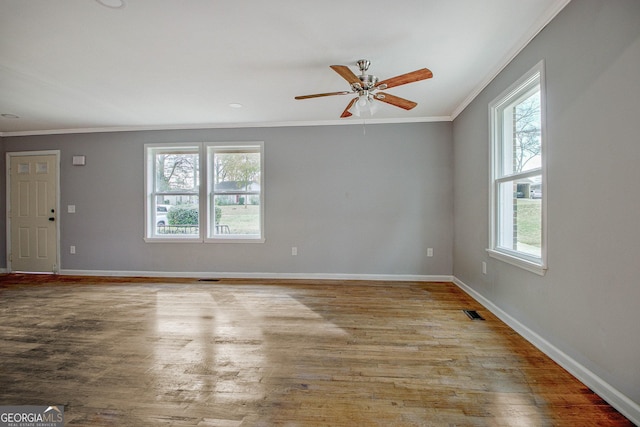 unfurnished room featuring light wood-type flooring, ceiling fan, and ornamental molding