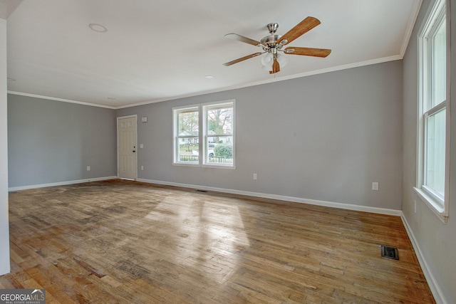 unfurnished room with crown molding, ceiling fan, and light wood-type flooring