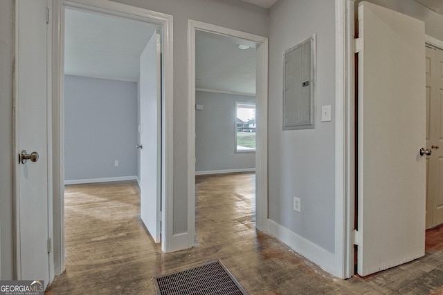 hallway with hardwood / wood-style floors and electric panel