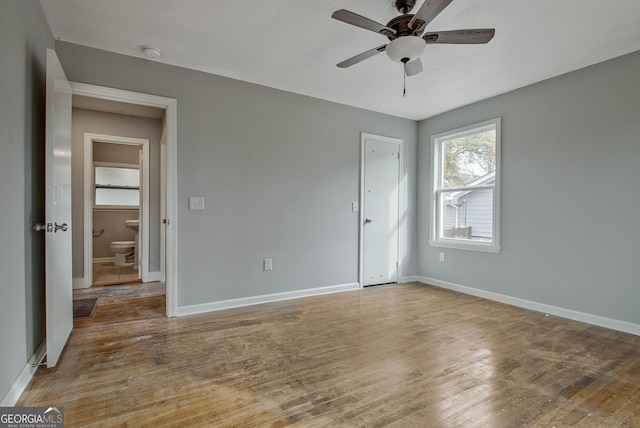 unfurnished bedroom featuring hardwood / wood-style flooring and ceiling fan