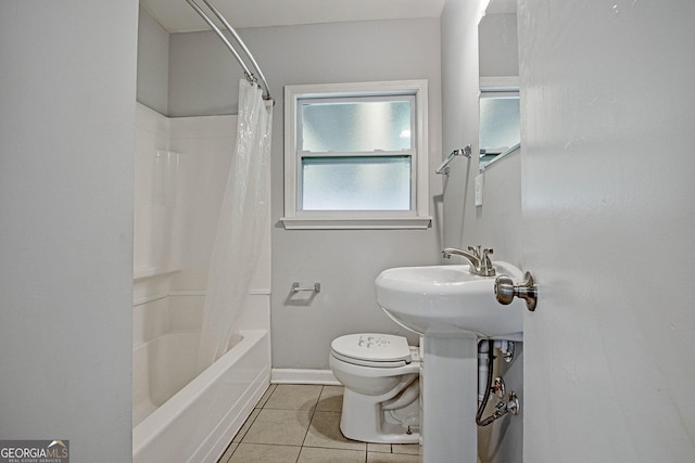 bathroom with tile patterned flooring, shower / bath combination with curtain, and toilet