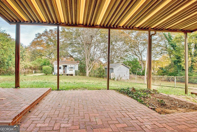 view of patio / terrace featuring an outbuilding