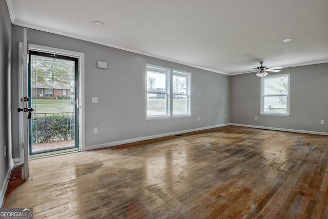 interior space with hardwood / wood-style flooring, plenty of natural light, ceiling fan, and ornamental molding