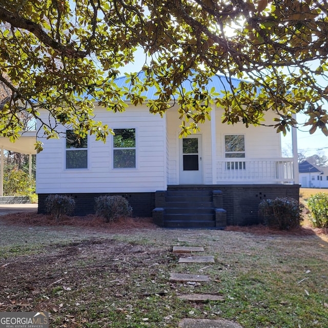 view of property exterior featuring a porch