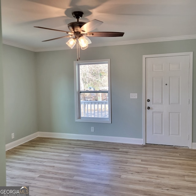 foyer with light hardwood / wood-style floors, ceiling fan, and crown molding