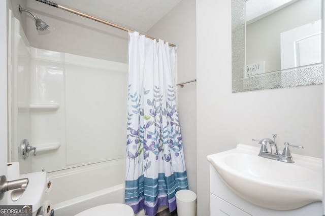 full bathroom with vanity, toilet, and shower / tub combo with curtain