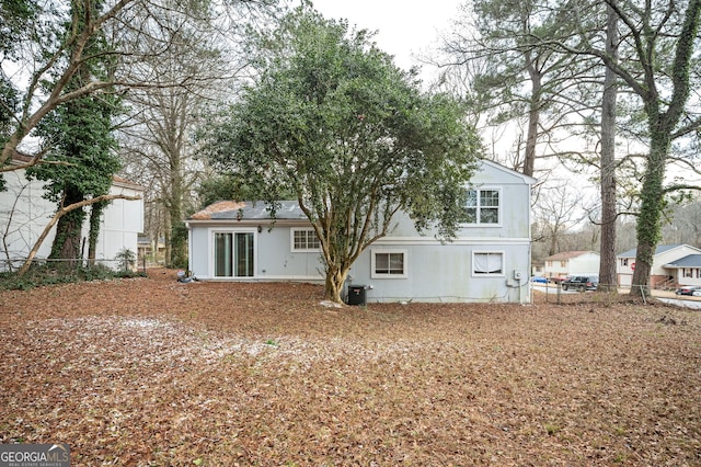 rear view of house with central air condition unit