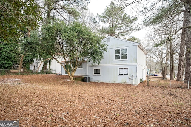 view of side of home featuring central AC unit