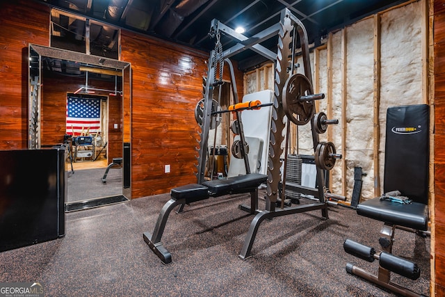 workout area with wooden walls