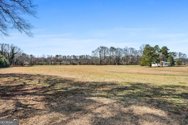 view of yard with a rural view