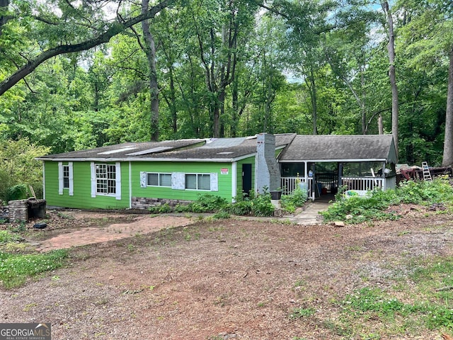 202 Hayes St, Villa Rica, GA 30180 - view of front facade featuring a chimney and roof with shingles