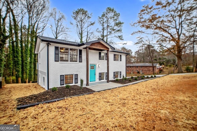 split foyer home with a patio area