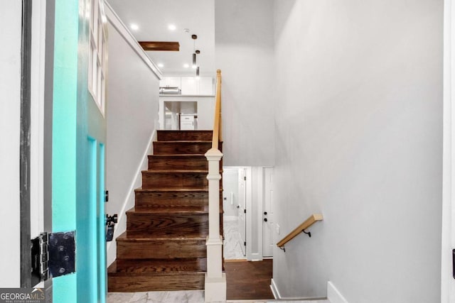 stairway with hardwood / wood-style flooring