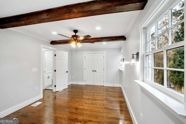 interior space featuring hardwood / wood-style floors, ceiling fan, beam ceiling, and crown molding