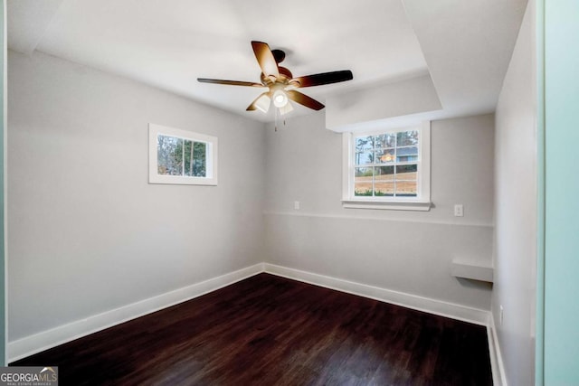 empty room with hardwood / wood-style floors and ceiling fan