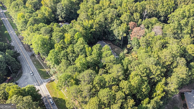 drone / aerial view with a view of trees